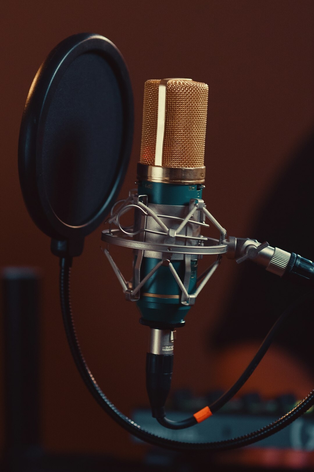 Cozy home recording studio with a vintage microphone and mixing desk