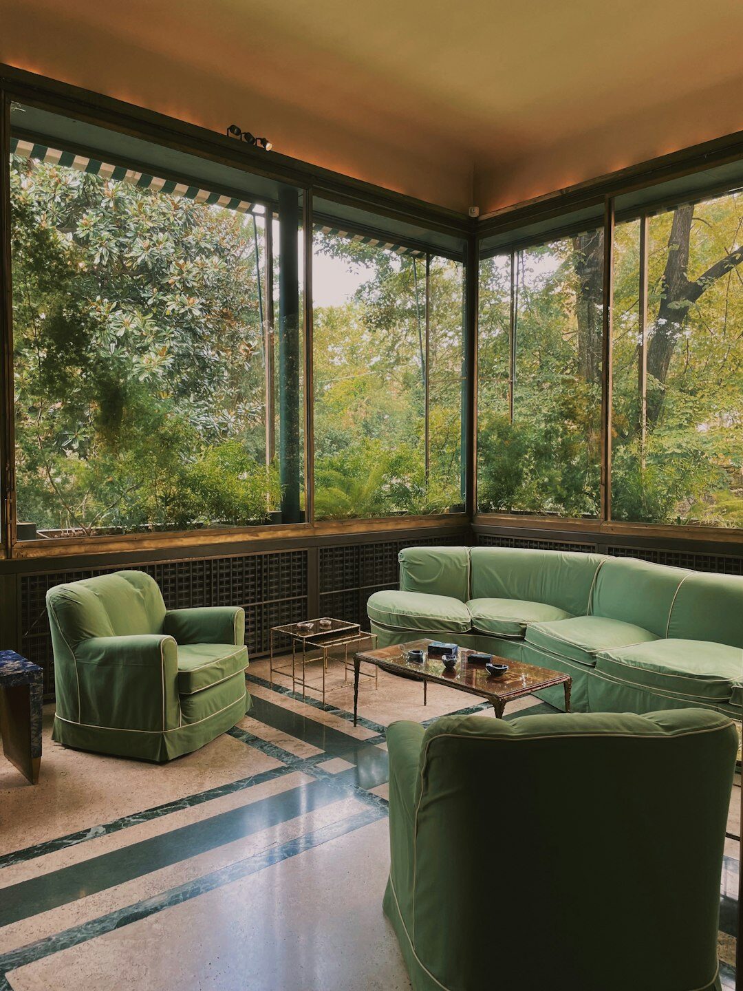 Elegant art deco lounge with green velvet armchairs